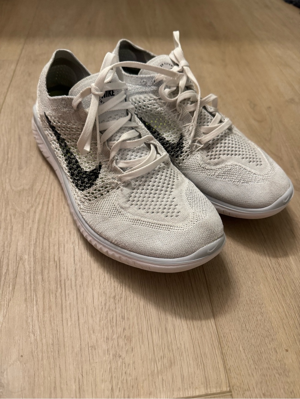 Nike Women’s White and Black Flyknit Sneakers